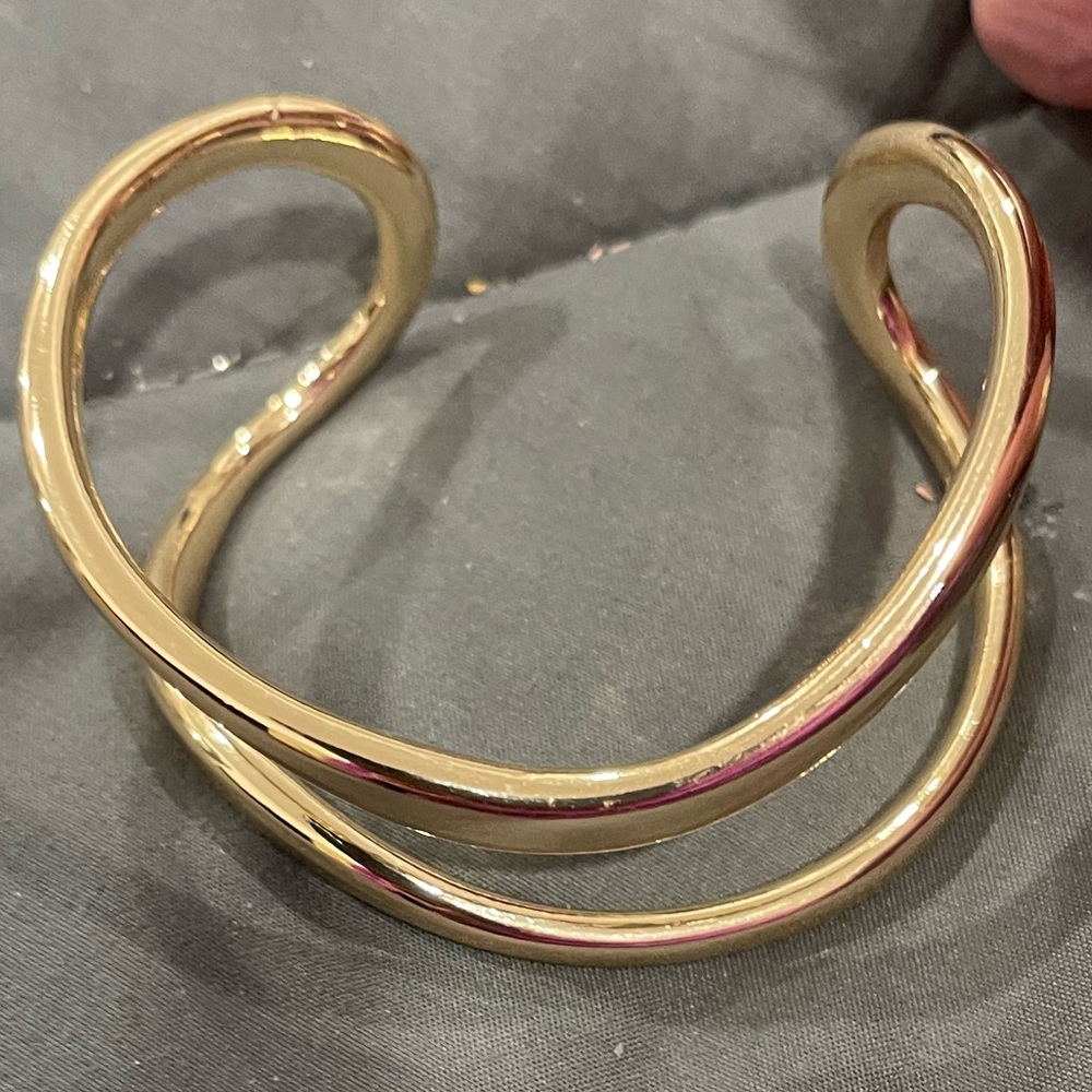 Super cool curvy gold bracelet. Also selling matching earrings
